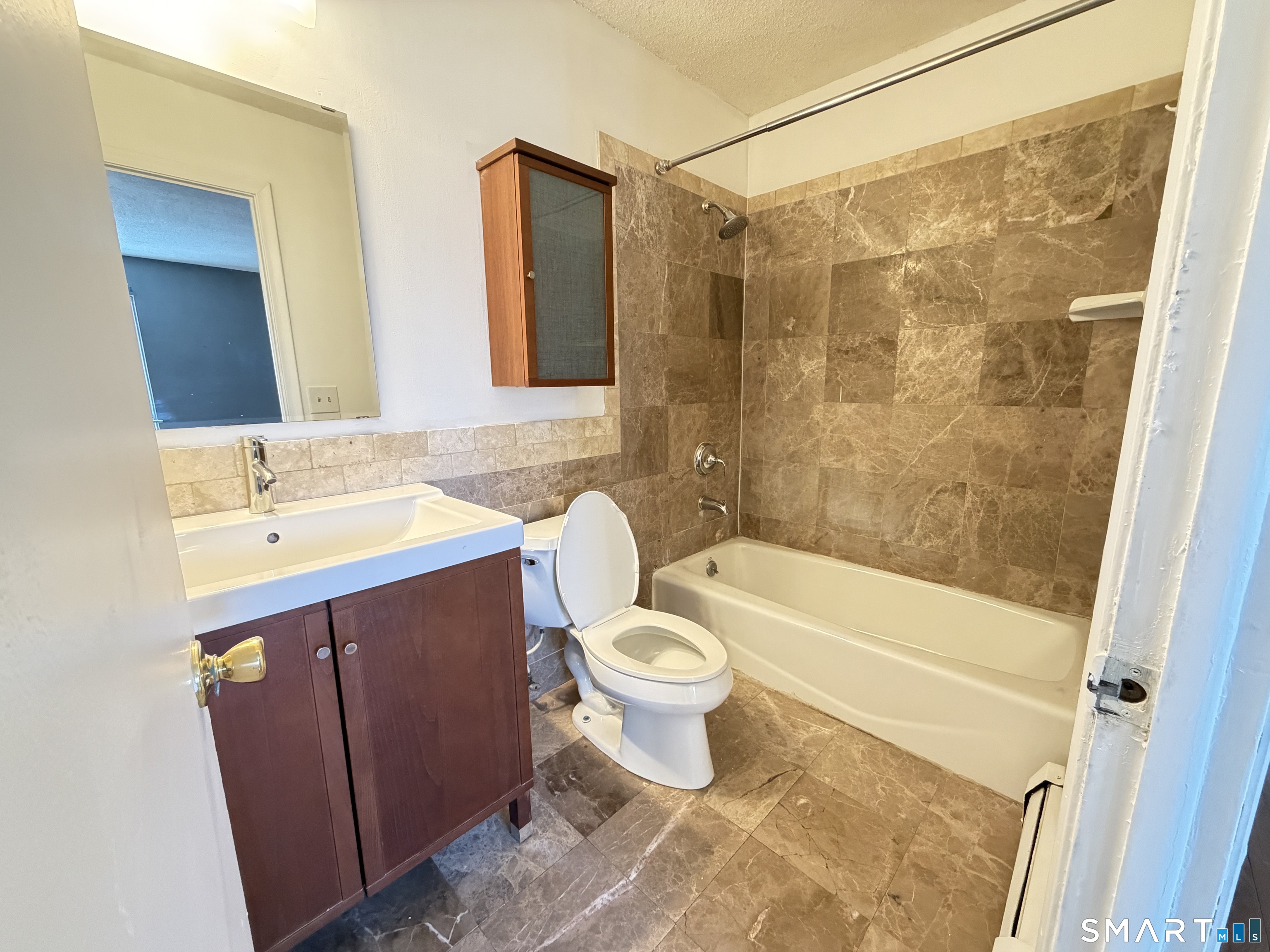 148 High Path Road, Unit 148 Windsor, CT 06095 - Photo 12 of 14 a bathroom with a sink toilet and shower