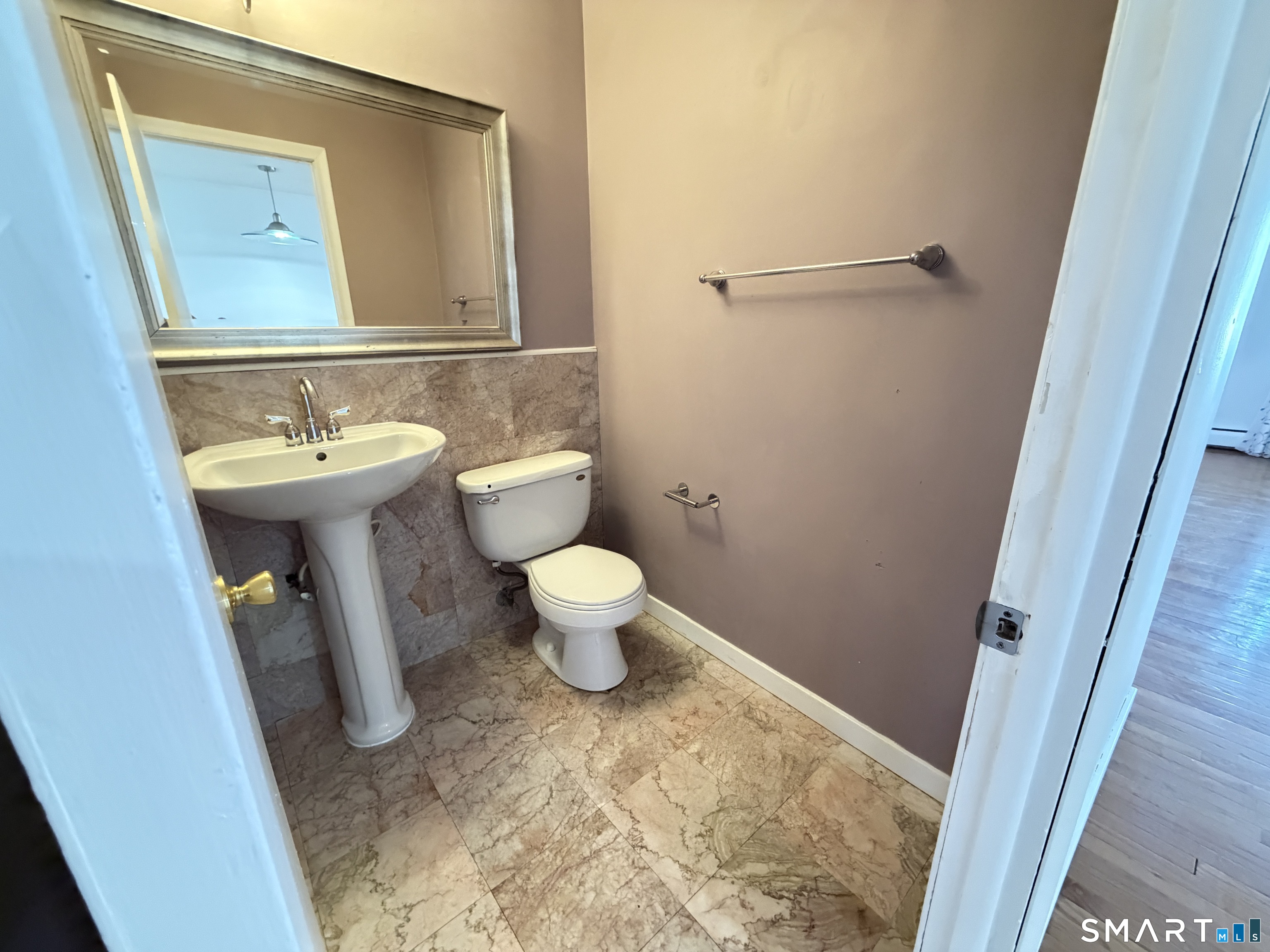 148 High Path Road, Unit 148 Windsor, CT 06095 - Photo 7 of 14 a bathroom with a sink and a toilet