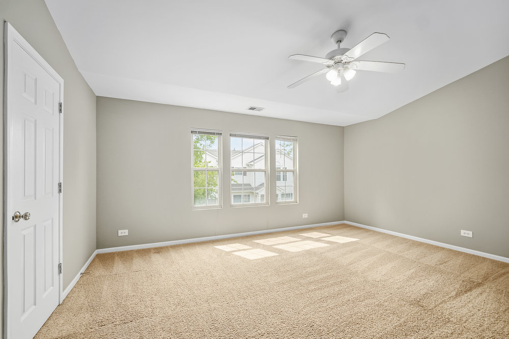 2277 Reflections Drive, Unit 2277 Aurora, IL 60502 - Photo 11 of 15 a view of an empty room with a window