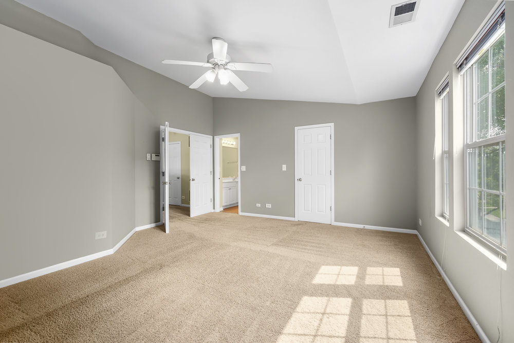 2277 Reflections Drive, Unit 2277 Aurora, IL 60502 - Photo 13 of 15 a view of an empty room with a window