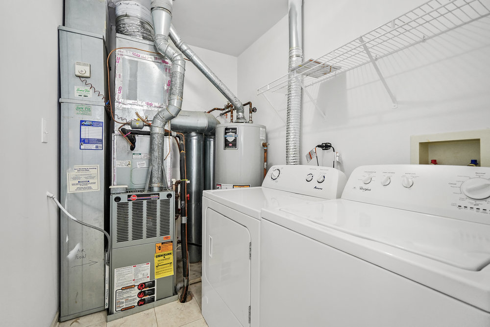 2277 Reflections Drive, Unit 2277 Aurora, IL 60502 - Photo 15 of 15 a view of a hallway with washer and dryer