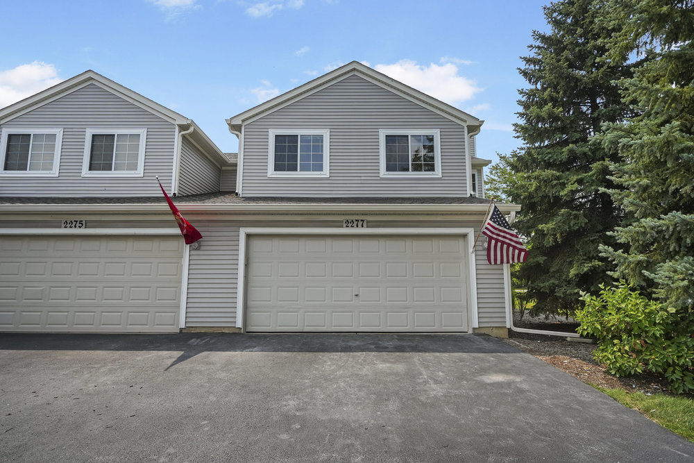 2277 Reflections Drive, Unit 2277 Aurora, IL 60502 - Photo 2 of 15 a house view with a outdoor space