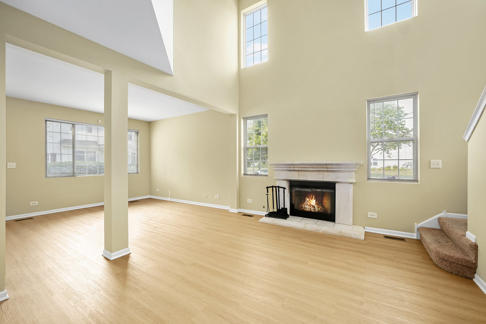 2277 Reflections Drive, Unit 2277 Aurora, IL 60502 - Photo 4 of 15 a view of an empty room with window and fire place
