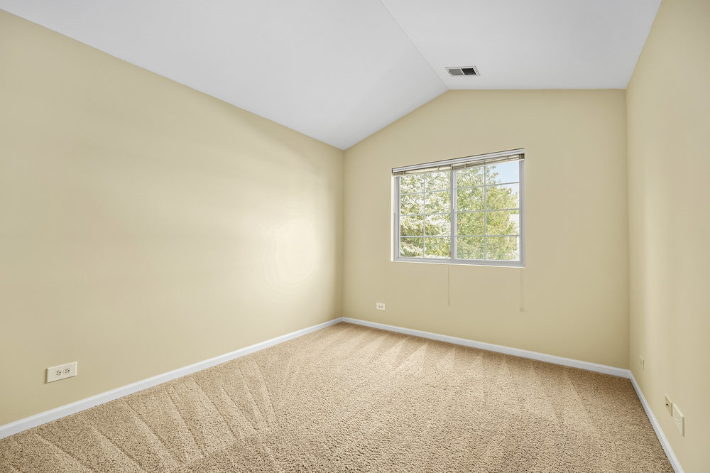 2277 Reflections Drive, Unit 2277 Aurora, IL 60502 - Photo 9 of 15 an empty room with a window