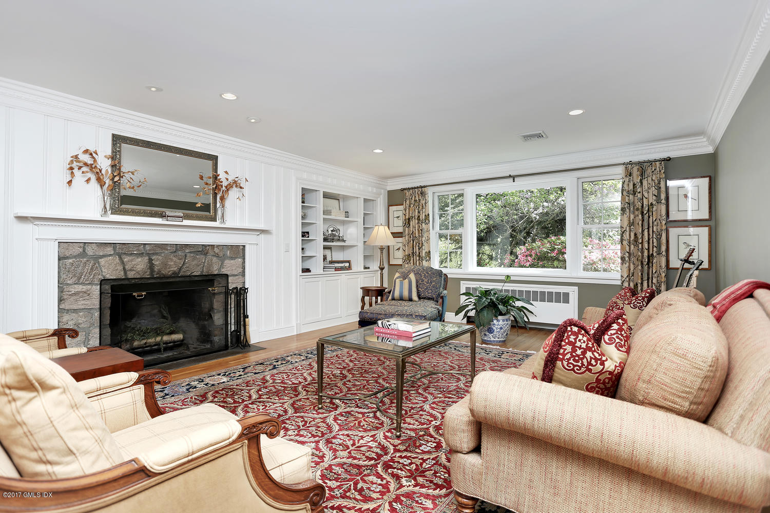 87 Hunting Ridge Road Stamford, CT 06903 - Photo 11 of 31 a living room with furniture and a fireplace