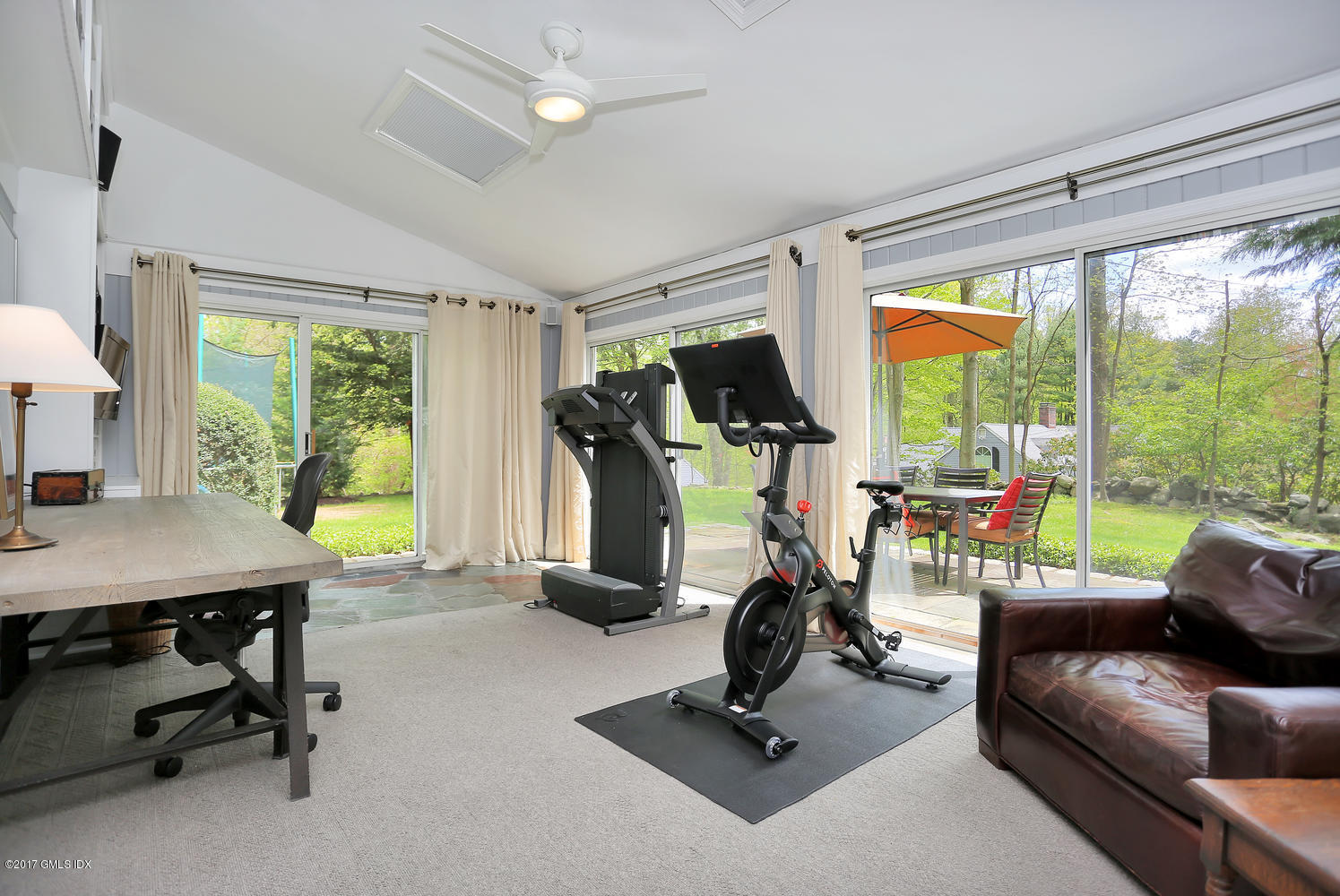 87 Hunting Ridge Road Stamford, CT 06903 - Photo 12 of 31 a view of a livingroom with workspace and a large window