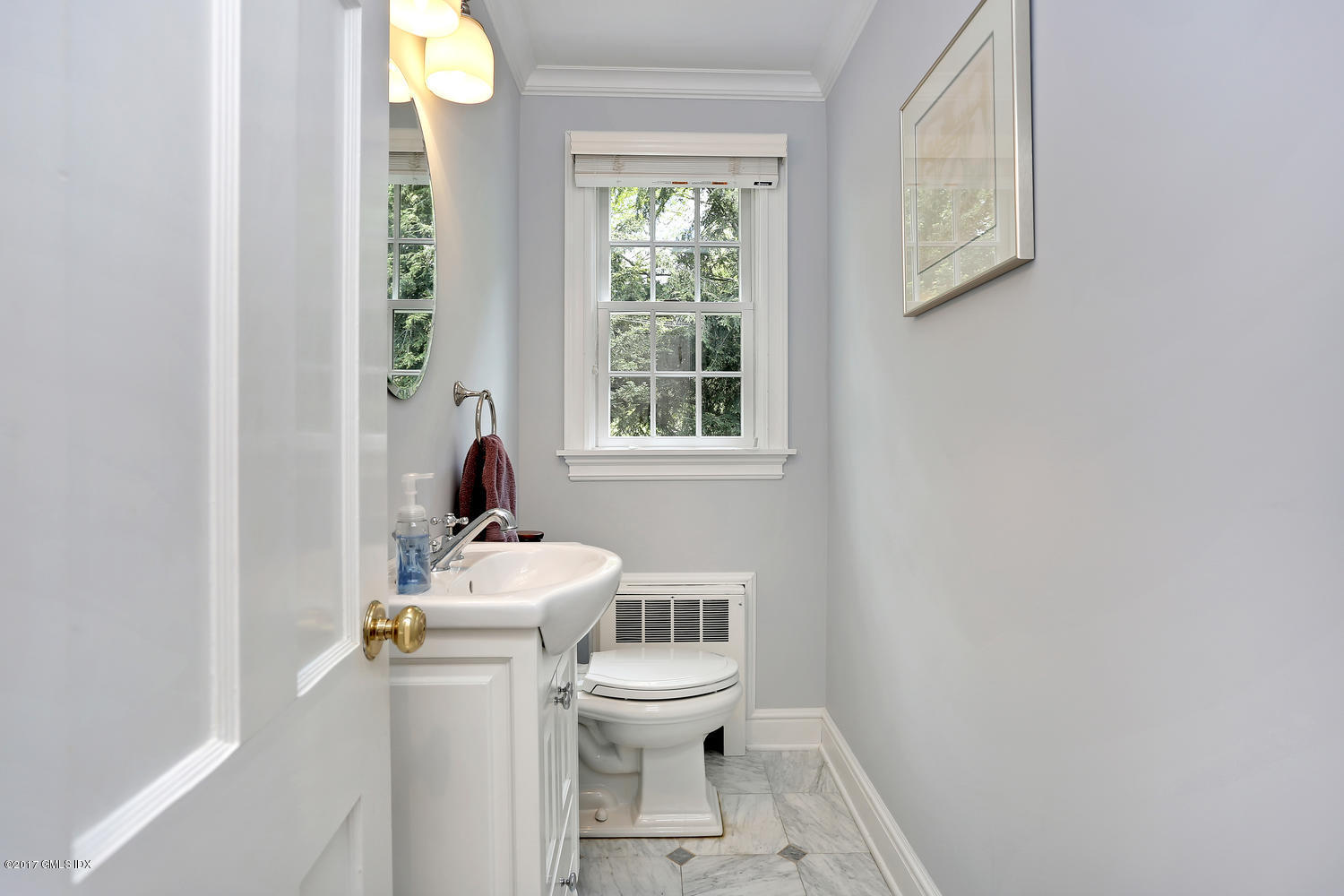 87 Hunting Ridge Road Stamford, CT 06903 - Photo 13 of 31 a bathroom with a toilet a sink and a window