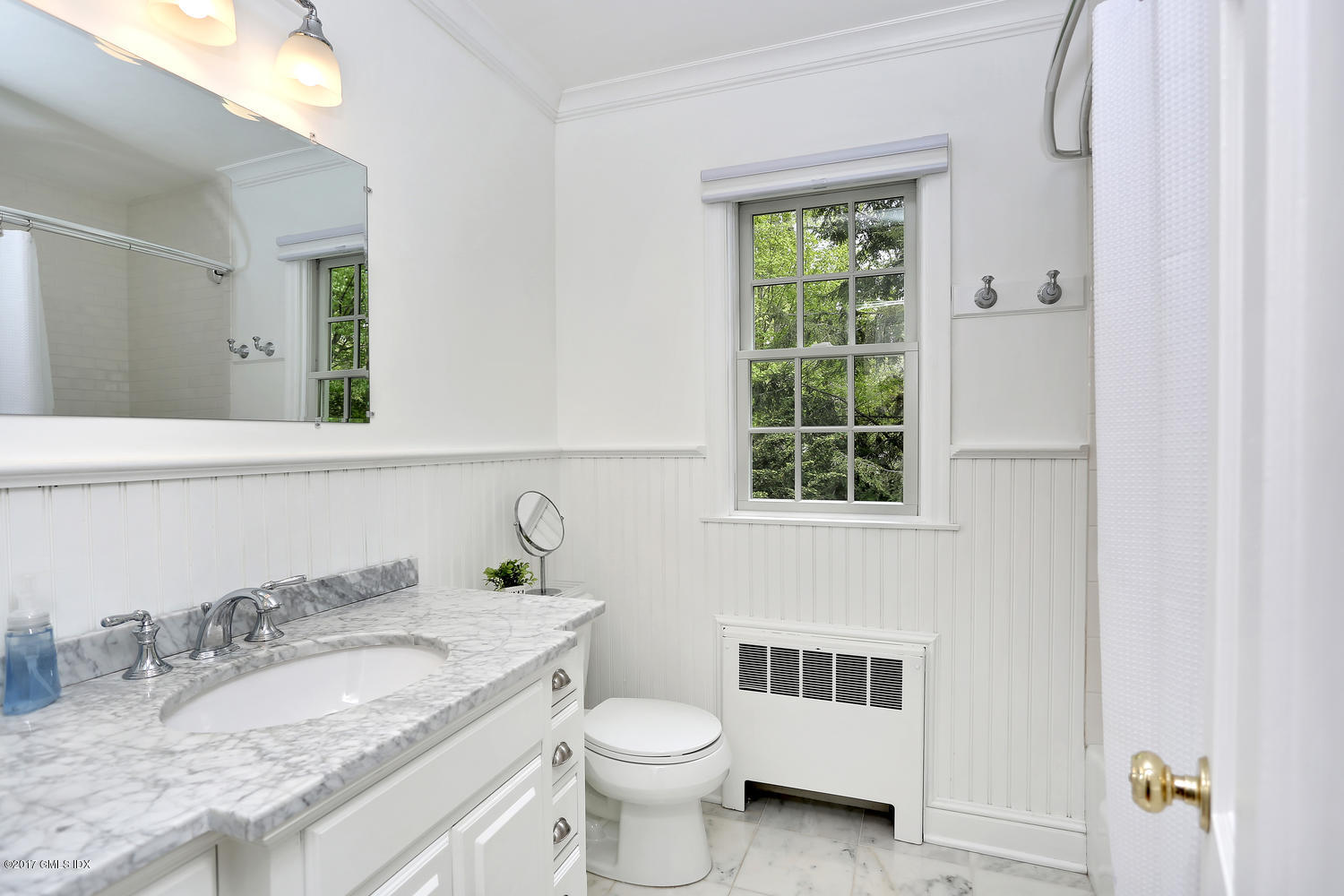 87 Hunting Ridge Road Stamford, CT 06903 - Photo 17 of 31 a bathroom with a granite countertop toilet a sink and a window