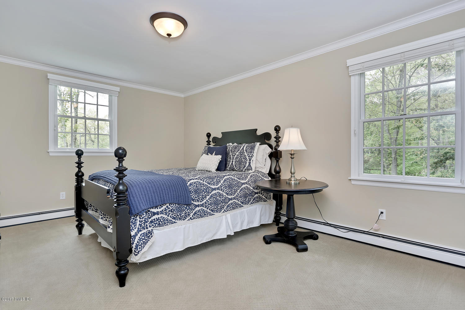 87 Hunting Ridge Road Stamford, CT 06903 - Photo 18 of 31 a bed room with a bed and a window