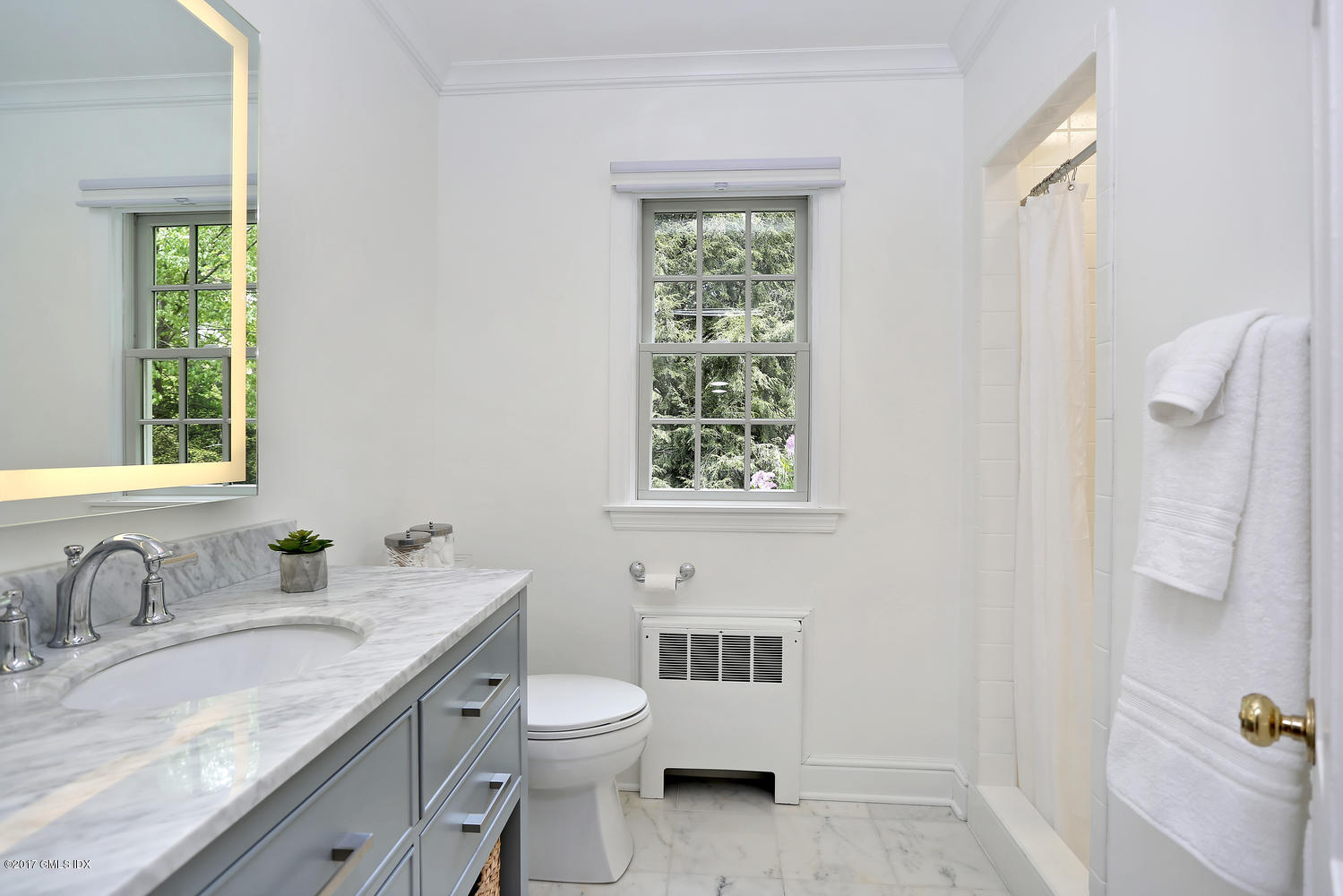87 Hunting Ridge Road Stamford, CT 06903 - Photo 19 of 31 a bathroom with a granite countertop toilet a sink and a window