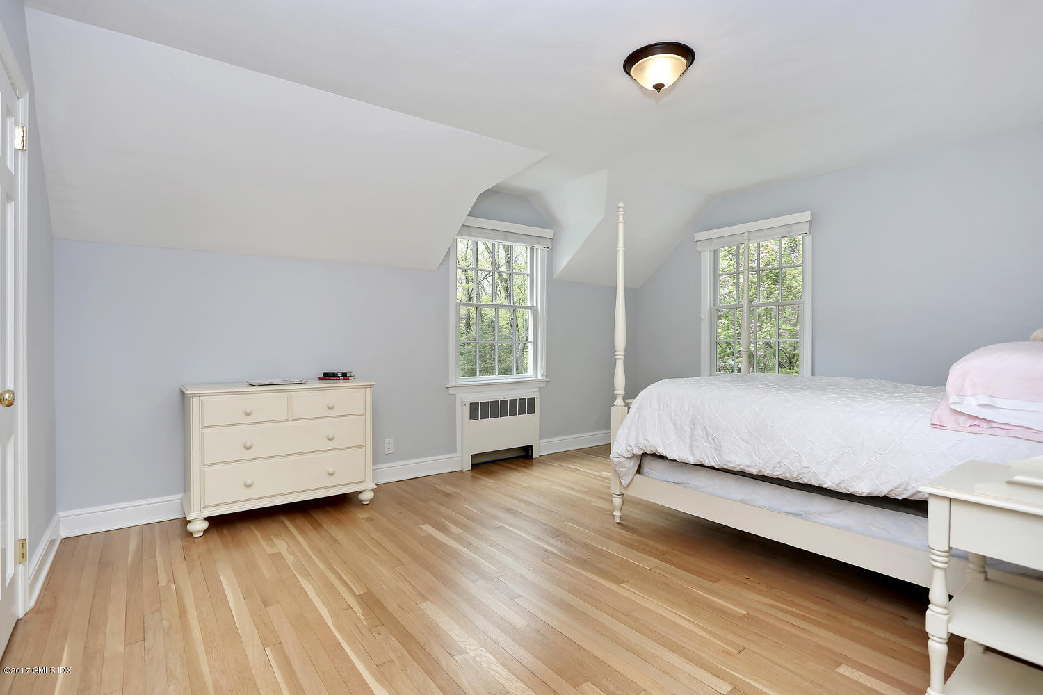 87 Hunting Ridge Road Stamford, CT 06903 - Photo 22 of 31 a bedroom with a bed and a window