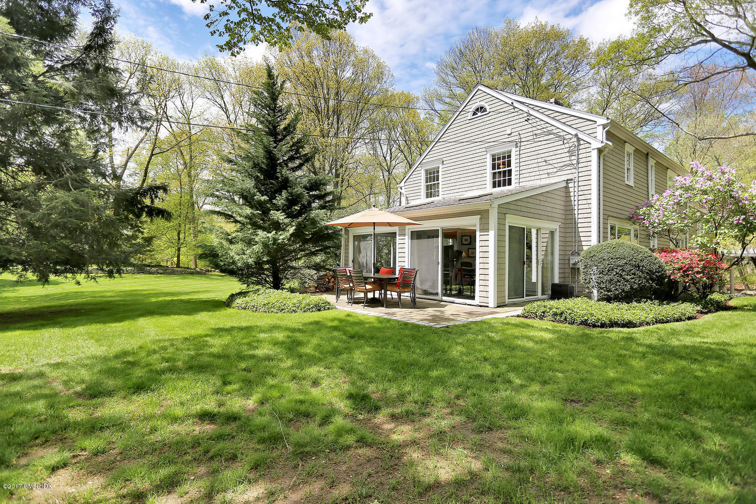 87 Hunting Ridge Road Stamford, CT 06903 - Photo 24 of 31 a view of a house with a yard and sitting area