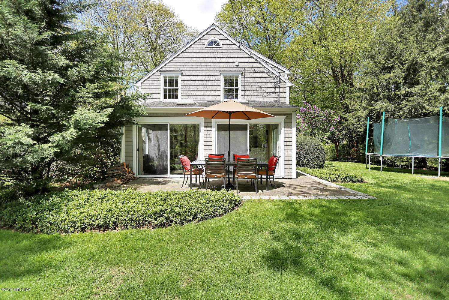 87 Hunting Ridge Road Stamford, CT 06903 - Photo 25 of 31 a view of a house with a yard and sitting area