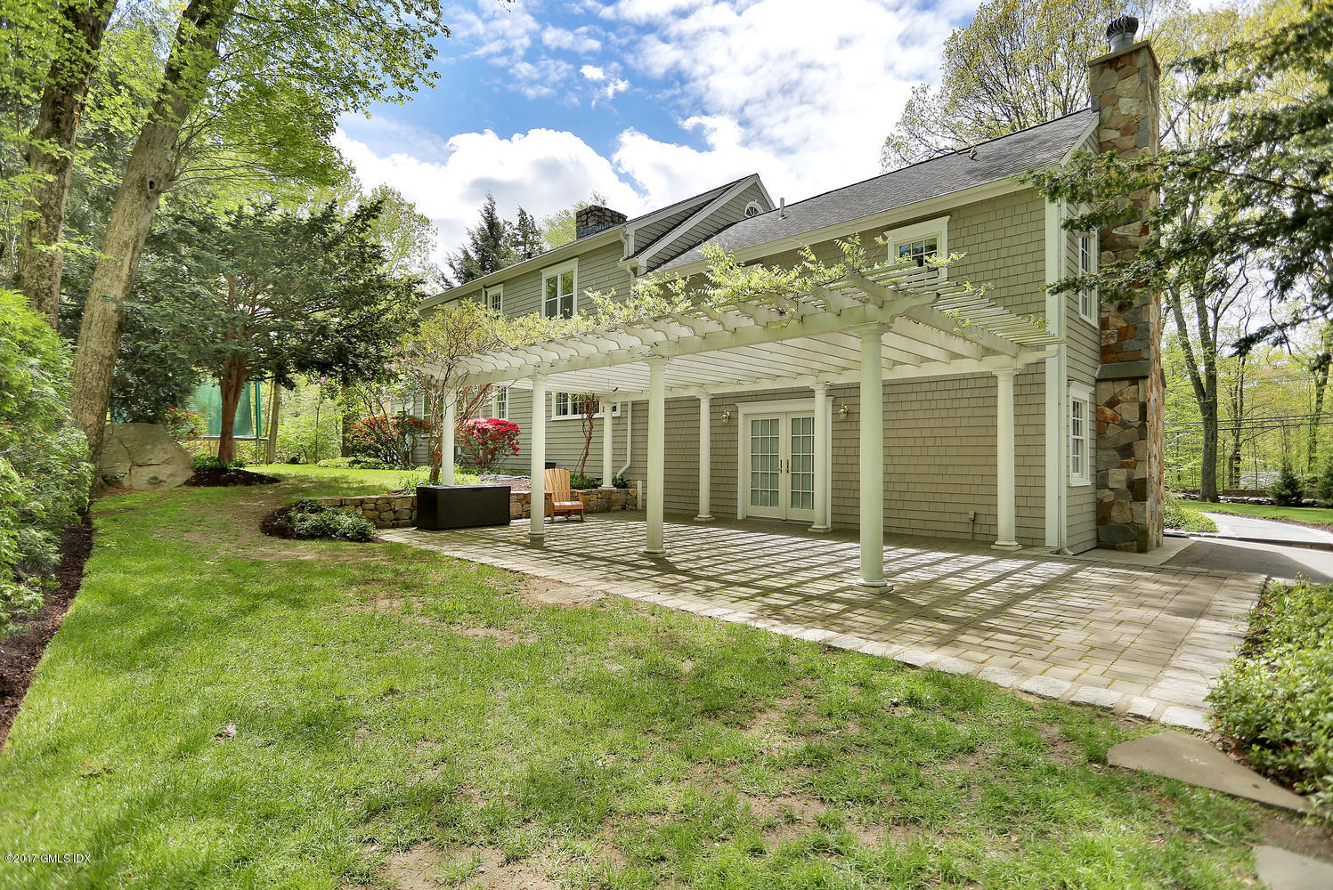 87 Hunting Ridge Road Stamford, CT 06903 - Photo 27 of 31 a view of a house with a yard and tree s