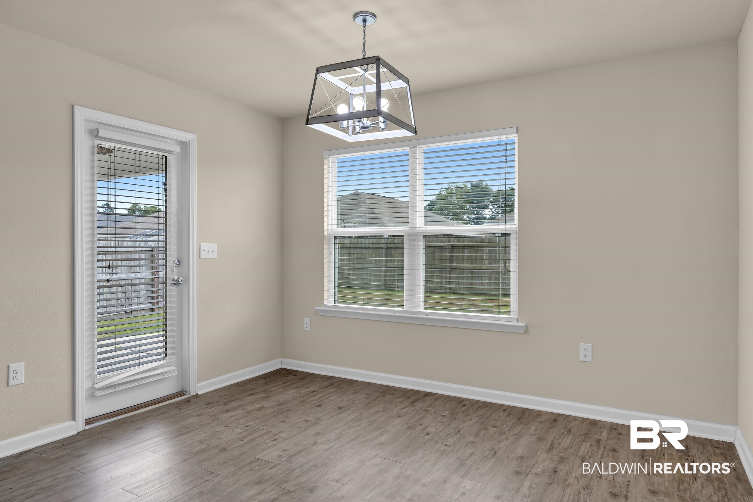 17344 Harding Drive Foley, AL 36535 - Photo 13 of 46 Neutral wall tones complement wood-finish flooring