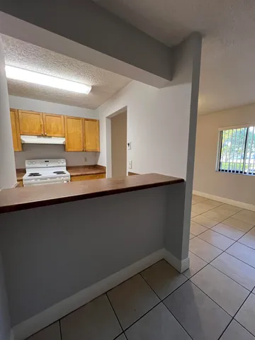a kitchen with stainless steel appliances a sink and a counter top space