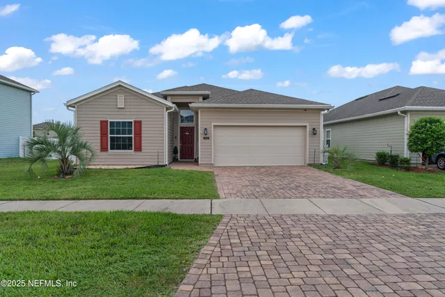 a front view of a house with yard