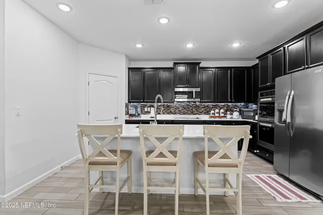 a bathroom with a sink double vanity and a mirror