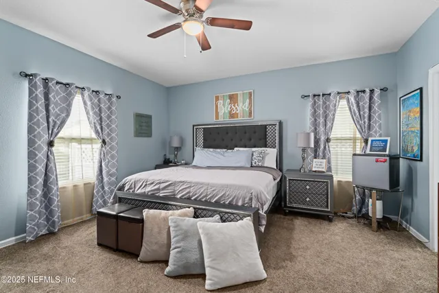 a bathroom with a toilet a sink and a mirror