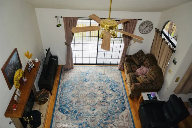 a view of a livingroom with furniture and a window