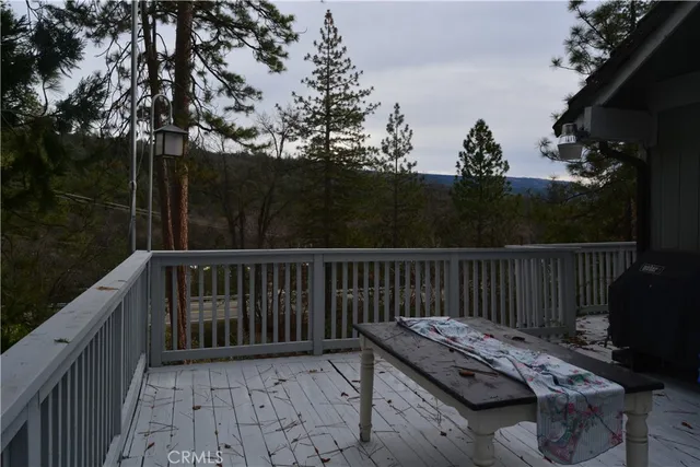 a view of a roof deck with wooden fence