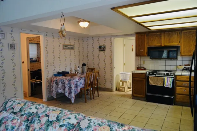 a bedroom with furniture and a wooden floor