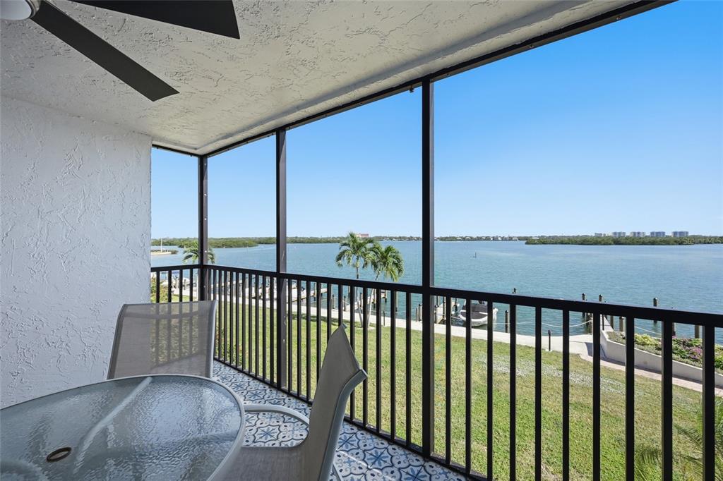 8977 Midnight Pass Road, Unit 223 Sarasota, FL 34242 - Photo 13 of 82 a view of a two chairs in the balcony
