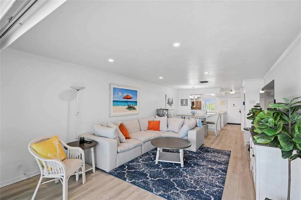 8977 Midnight Pass Road, Unit 223 Sarasota, FL 34242 - Photo 18 of 82 a living room with furniture and a rug