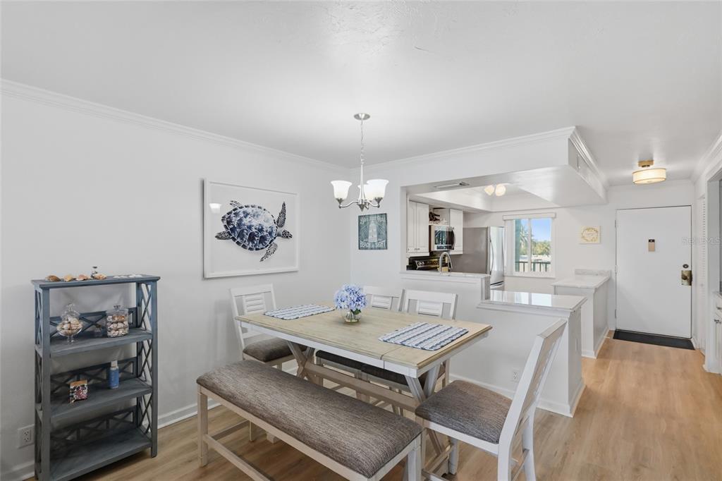8977 Midnight Pass Road, Unit 223 Sarasota, FL 34242 - Photo 21 of 82 a living room with furniture and wooden floor