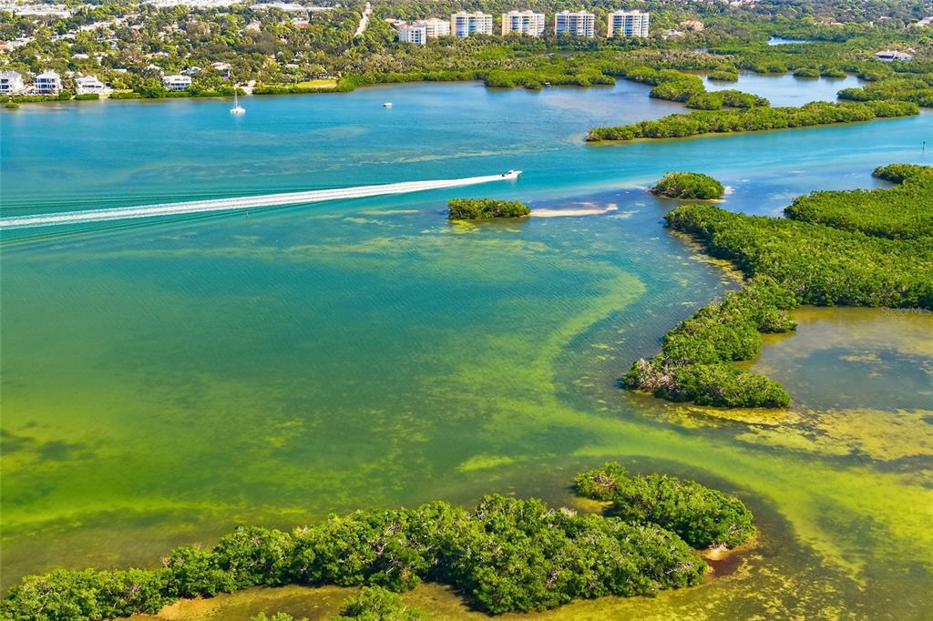8977 Midnight Pass Road, Unit 223 Sarasota, FL 34242 - Photo 35 of 82 a view of a lake with houses