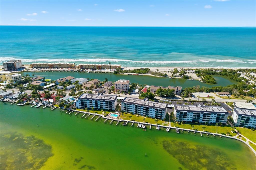 8977 Midnight Pass Road, Unit 223 Sarasota, FL 34242 - Photo 39 of 82 a view of a city with lawn chairs