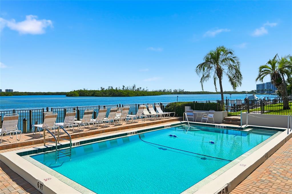 8977 Midnight Pass Road, Unit 223 Sarasota, FL 34242 - Photo 44 of 82 a view of a lake with couches chairs
