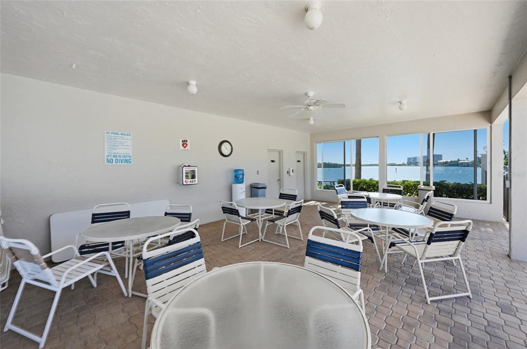 8977 Midnight Pass Road, Unit 223 Sarasota, FL 34242 - Photo 54 of 82 a living room with lots of furniture and a large window