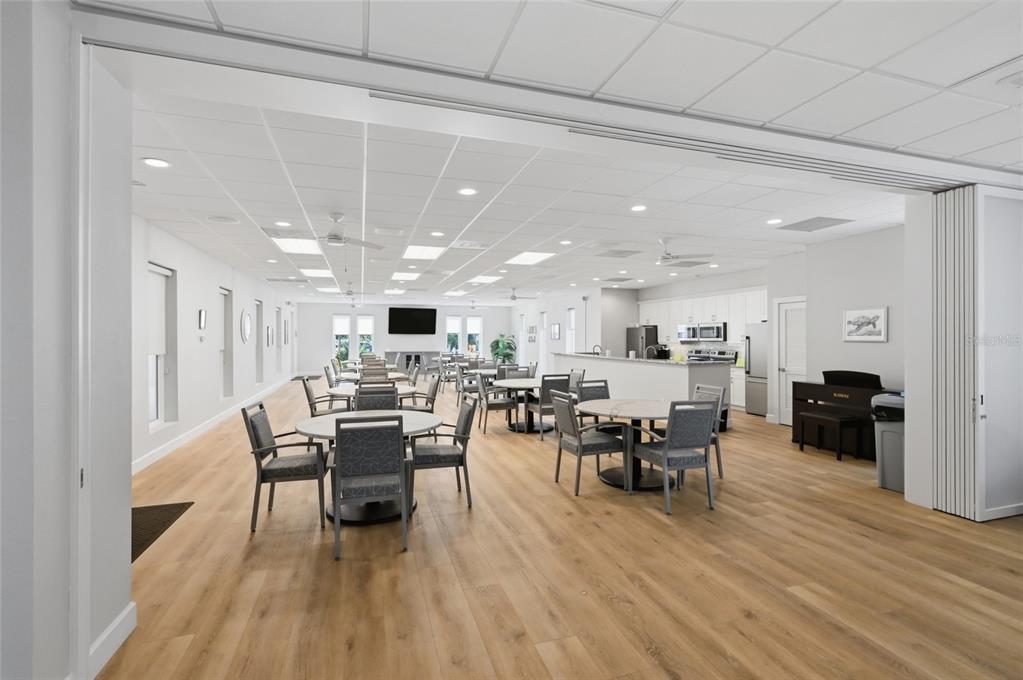 8977 Midnight Pass Road, Unit 223 Sarasota, FL 34242 - Photo 58 of 82 a view of a dining room with furniture and wooden floor