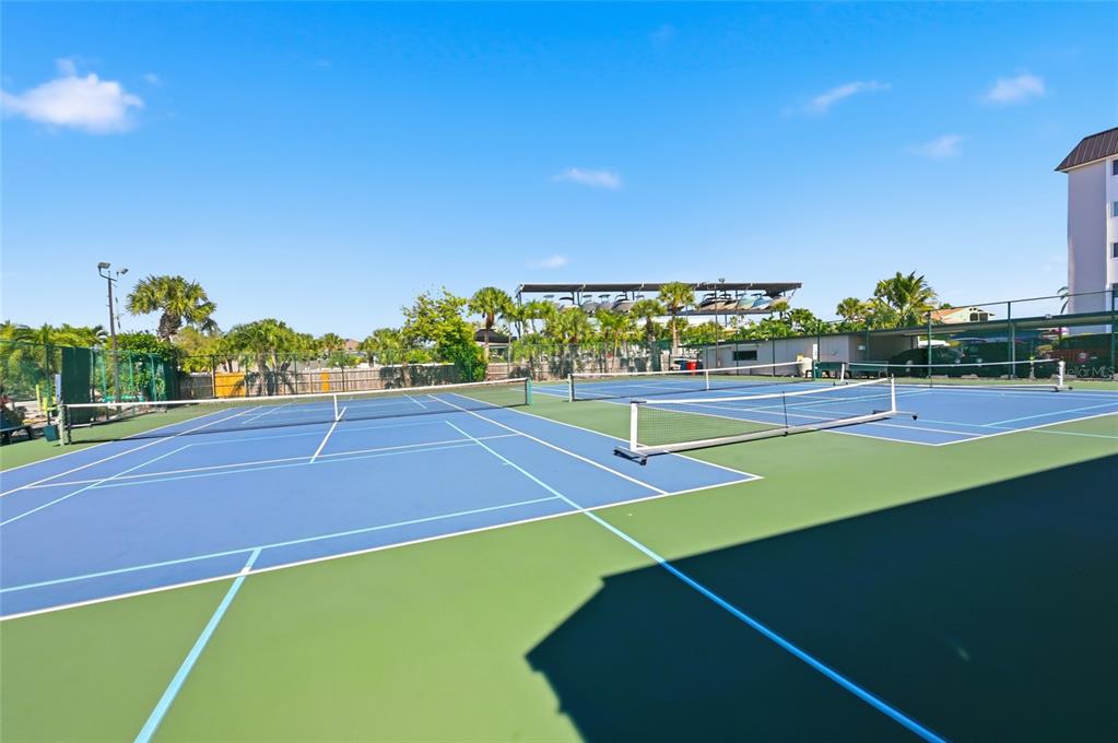 8977 Midnight Pass Road, Unit 223 Sarasota, FL 34242 - Photo 63 of 82 a view of an outdoor space and tennis court