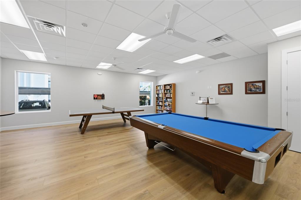 8977 Midnight Pass Road, Unit 223 Sarasota, FL 34242 - Photo 64 of 82 a room with pool table and windows