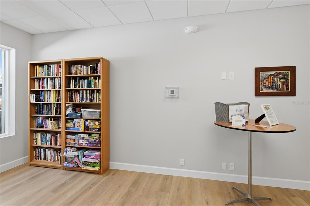 8977 Midnight Pass Road, Unit 223 Sarasota, FL 34242 - Photo 65 of 82 a view of a livingroom with shelves