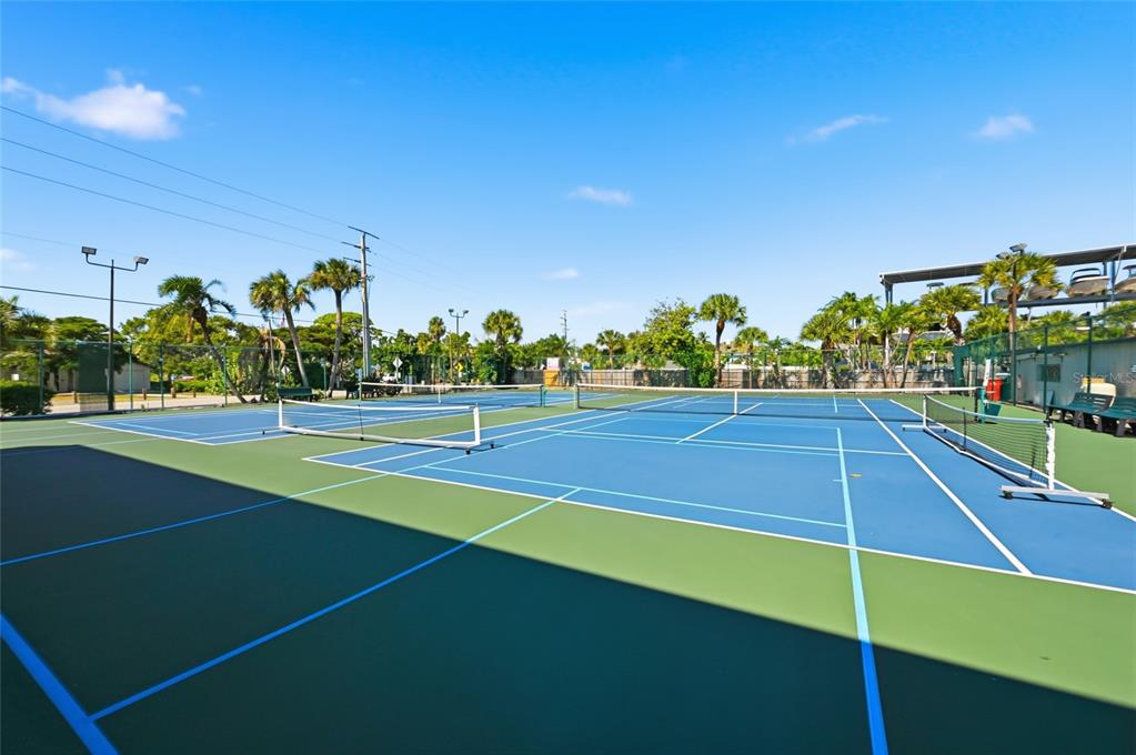 8977 Midnight Pass Road, Unit 223 Sarasota, FL 34242 - Photo 66 of 82 a view of an outdoor space and tennis court