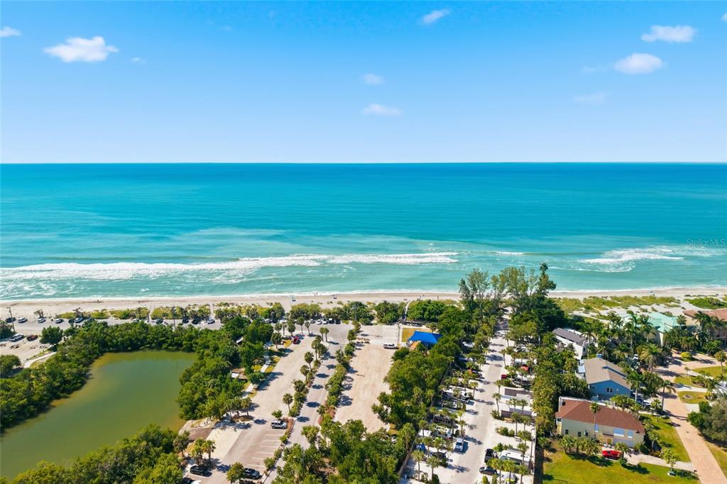 8977 Midnight Pass Road, Unit 223 Sarasota, FL 34242 - Photo 70 of 82 a view of an ocean and beach