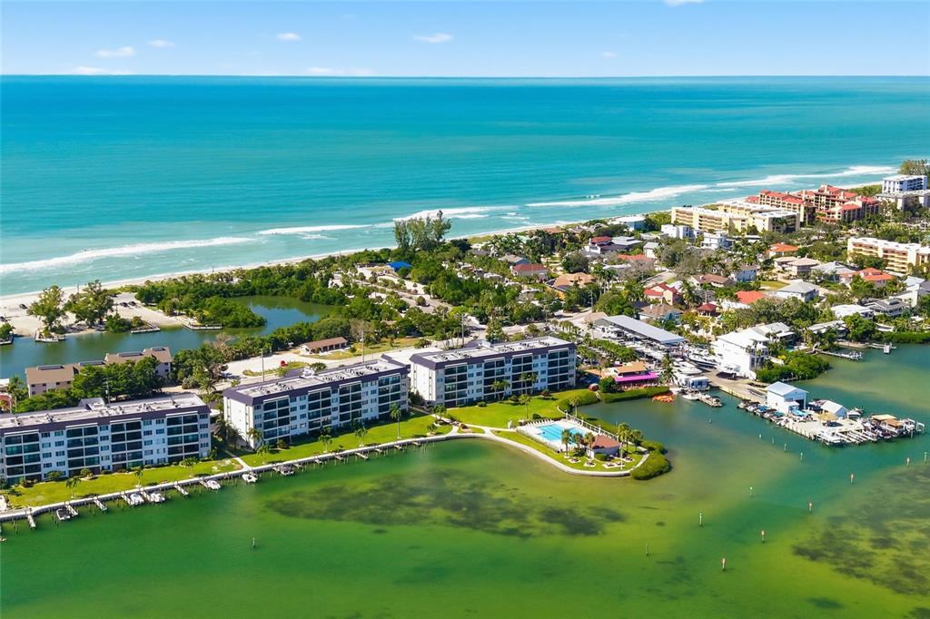 8977 Midnight Pass Road, Unit 223 Sarasota, FL 34242 - Photo 81 of 82 a view of a lake with a city