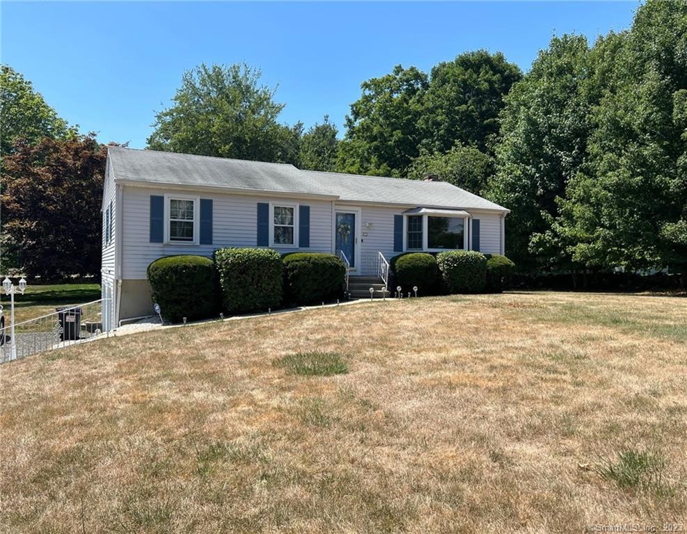 330 East River Road Guilford, CT 06437 - Photo 1 of 1 a front view of a house with a yard and trees