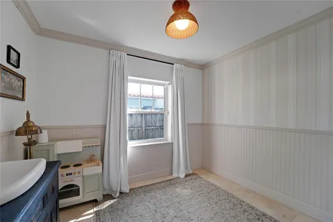 a view of an empty room and a window