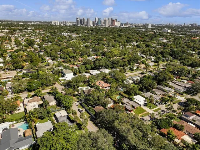 an aerial view of a city and mountain