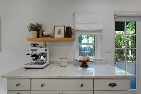 a kitchen with sink and window