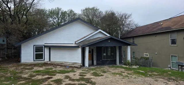 a house with trees in the background