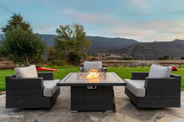 a view of a yard with a mountain