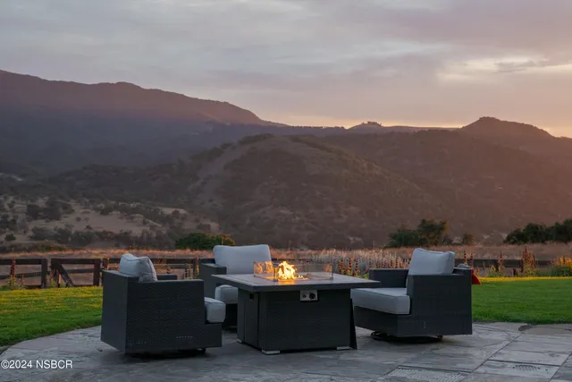 a view of a lake with houses in the back