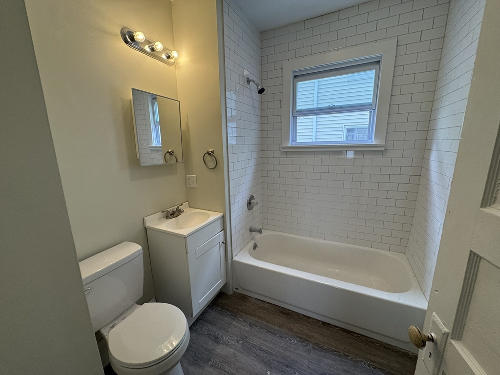 72 Forest Street, Unit 2 Attleboro, MA 02703 - Photo 9 of 10 a bathroom with a toilet a sink and bathtub