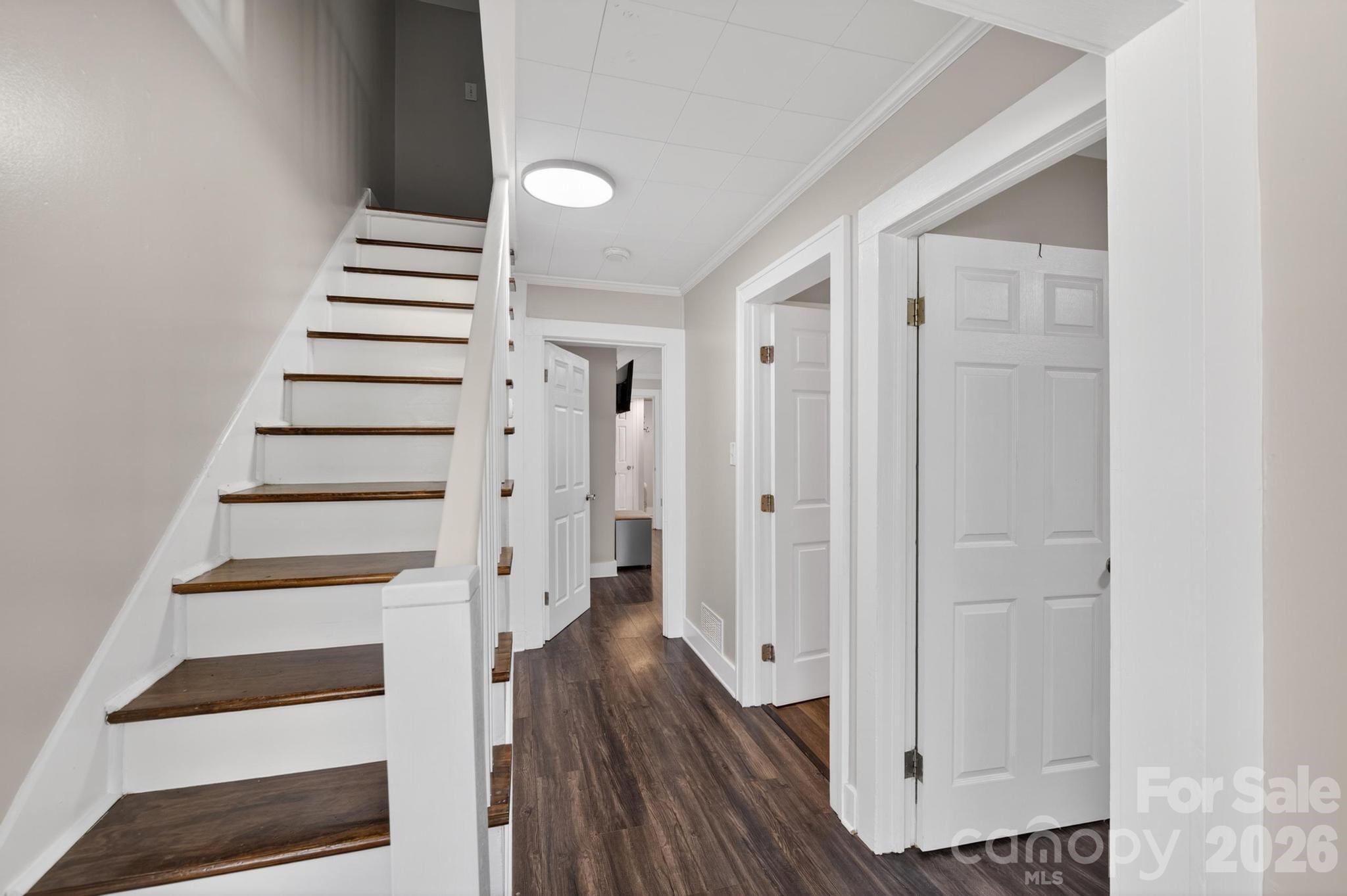 2076 Connelly Springs Road Lenoir, NC 28645 - Photo 12 of 47 a view of entryway with wooden floor and white walls