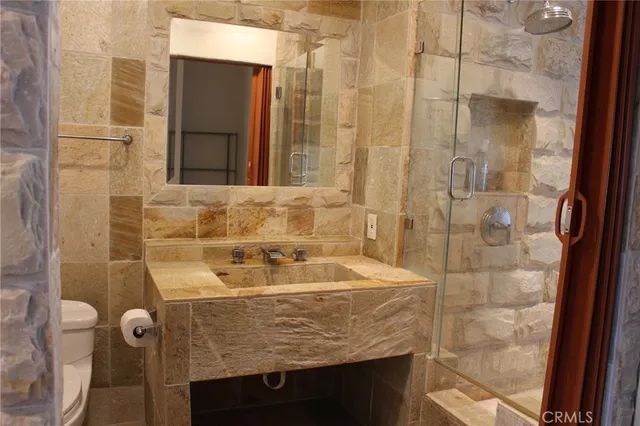 a bathroom with a sink and a shower